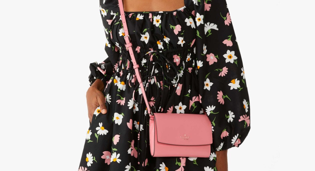 pink cross body on woman with floral dress