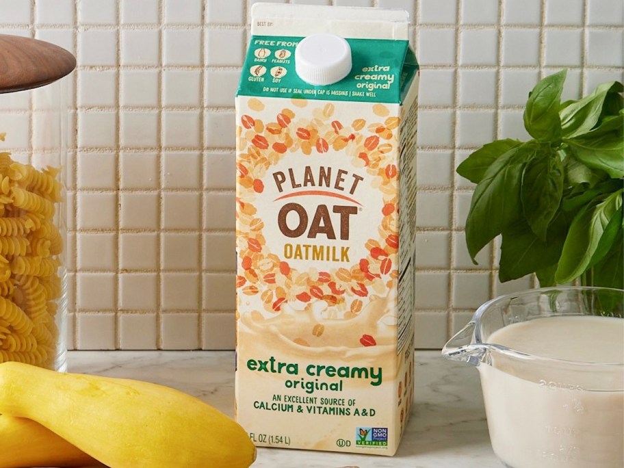 planet oat oatmilk container sitting on countertop 