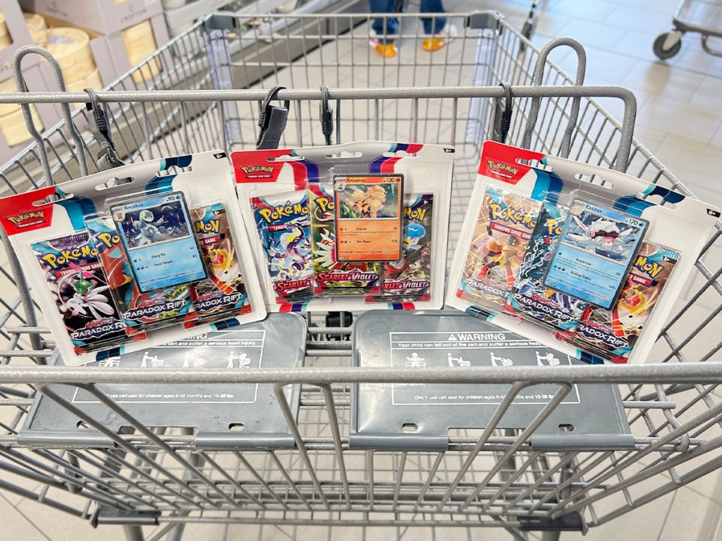 three pokemon packs in shopping cart