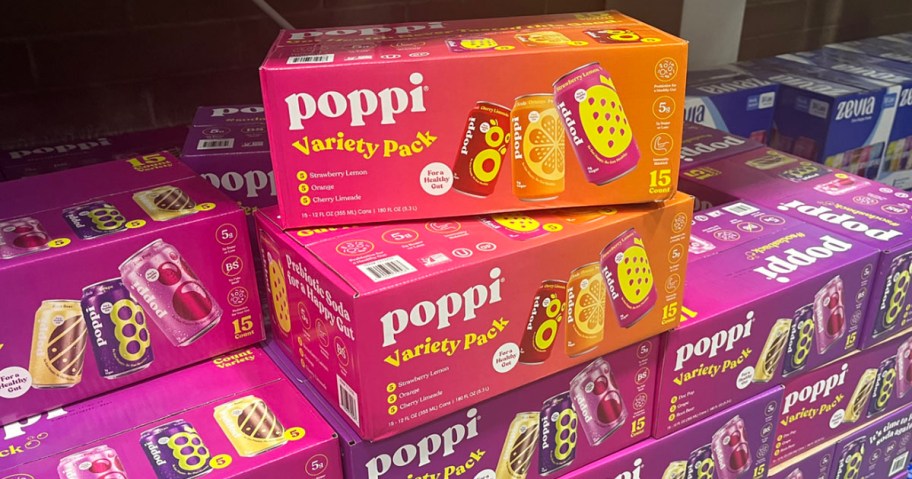 15 packs of poppi soda stacked in store