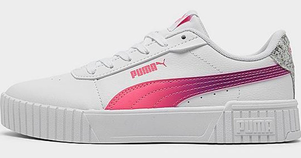 white and pink puma low top shoe