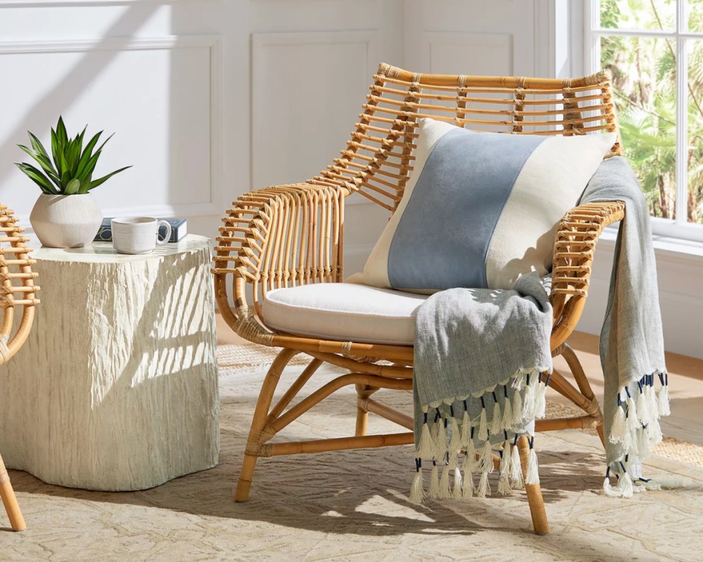 rattan accent chair with white accent pillow