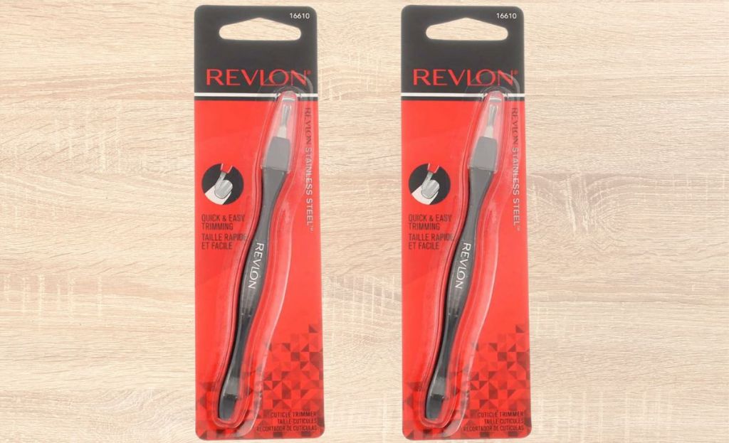 two packages of revlon cuticle trimmers on wooden background