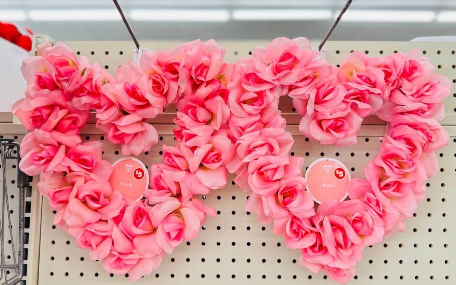 two heart shaped wreaths made of pink artificial roses