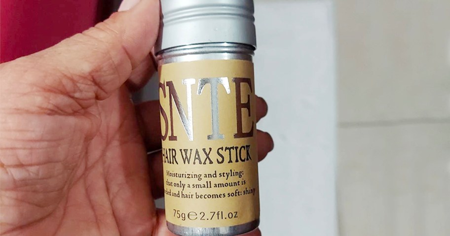 hand holding samnyte hair wax stick