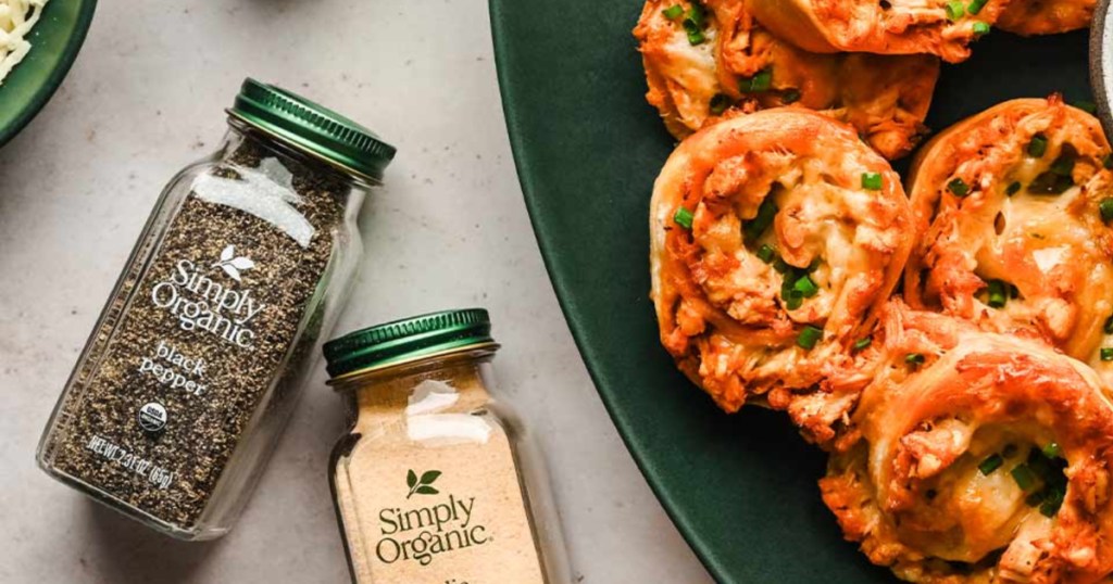 simply organic pepper bottle next to a plate of pinwheels