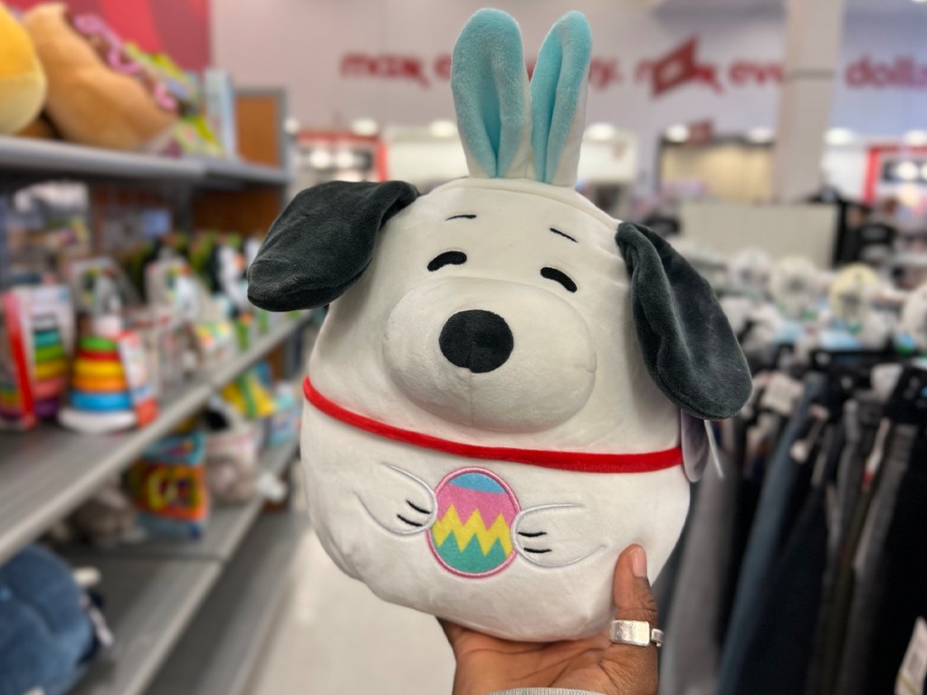 hand holding snoopy peanuts easter squishmallow