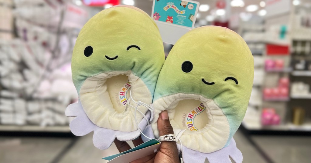 hand holding octopus squishmallow slippers 