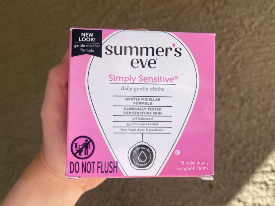 box of summers eve wipes being held up by hand