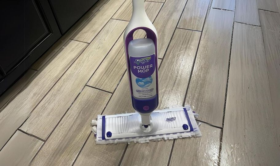 swiffer power mop in a kitchen shown with a shiny floor