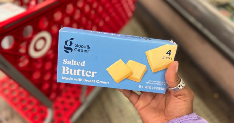holding a box of butter at Target