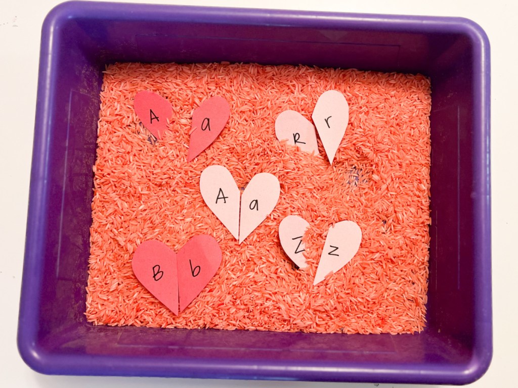 paper hearts in pink rice