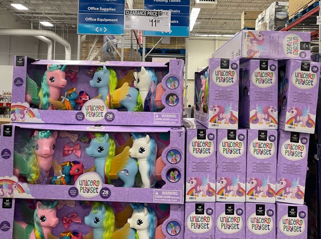 unicorn playsets stacked in a store