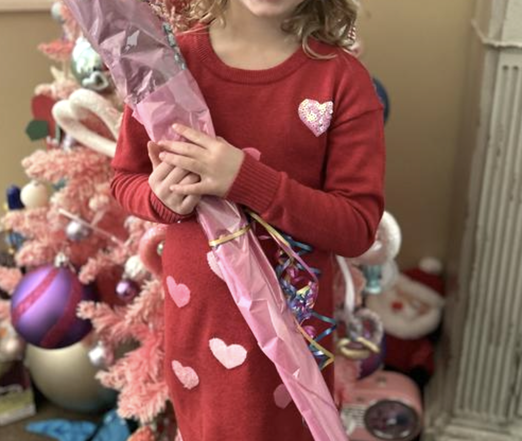 little girl wearing Valentine's Day dress 