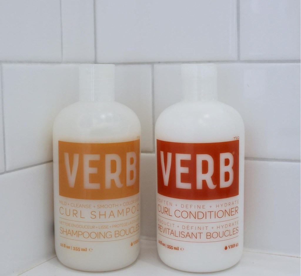 curl conditioner and shampoo bottles in tub