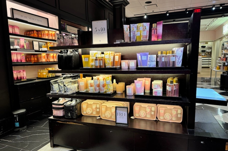 inside of victorias secret store with lotion and body sprays on black shelves