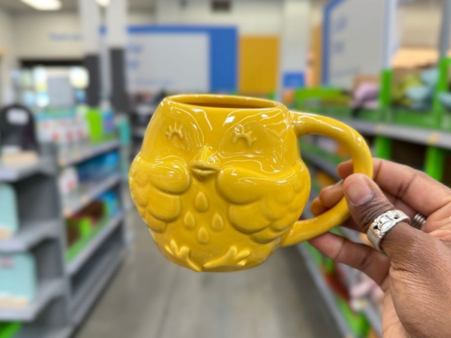 hand holding a Yellow Chick Coffee Mug 