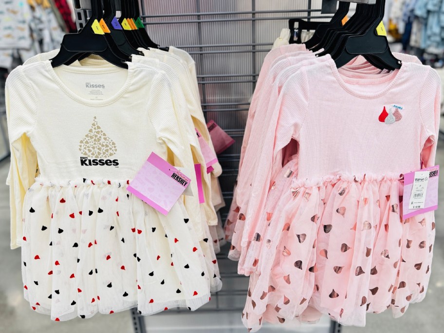 two kisses valentines dresses hanging in store 