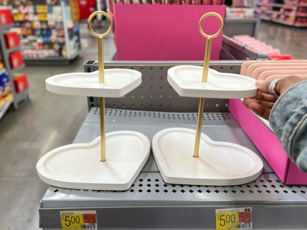 white heart shaped 2 tiered trays on a shelf in a walmart store