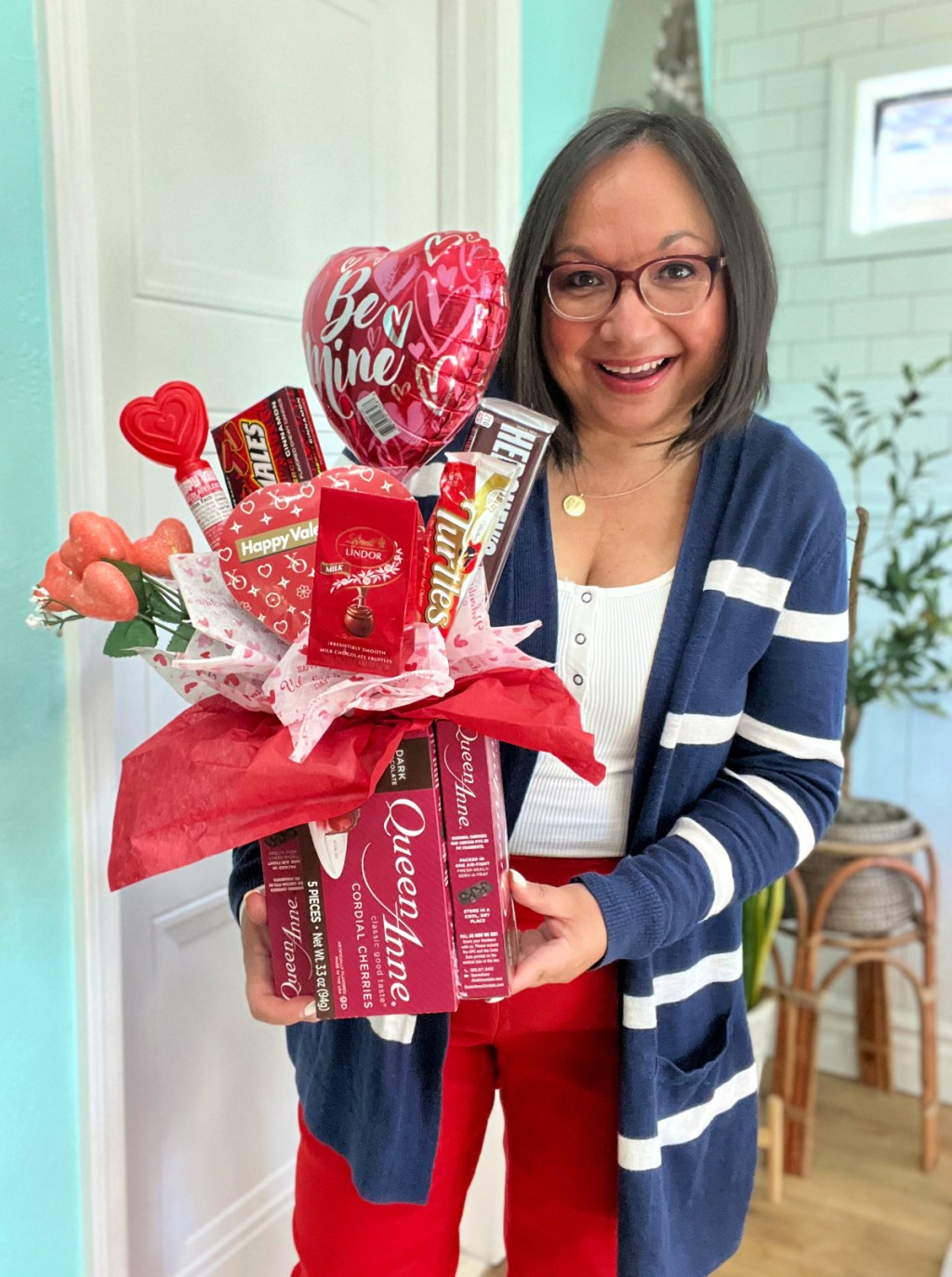 woman holding a bouquet of candy from dollar tree for valentine's day