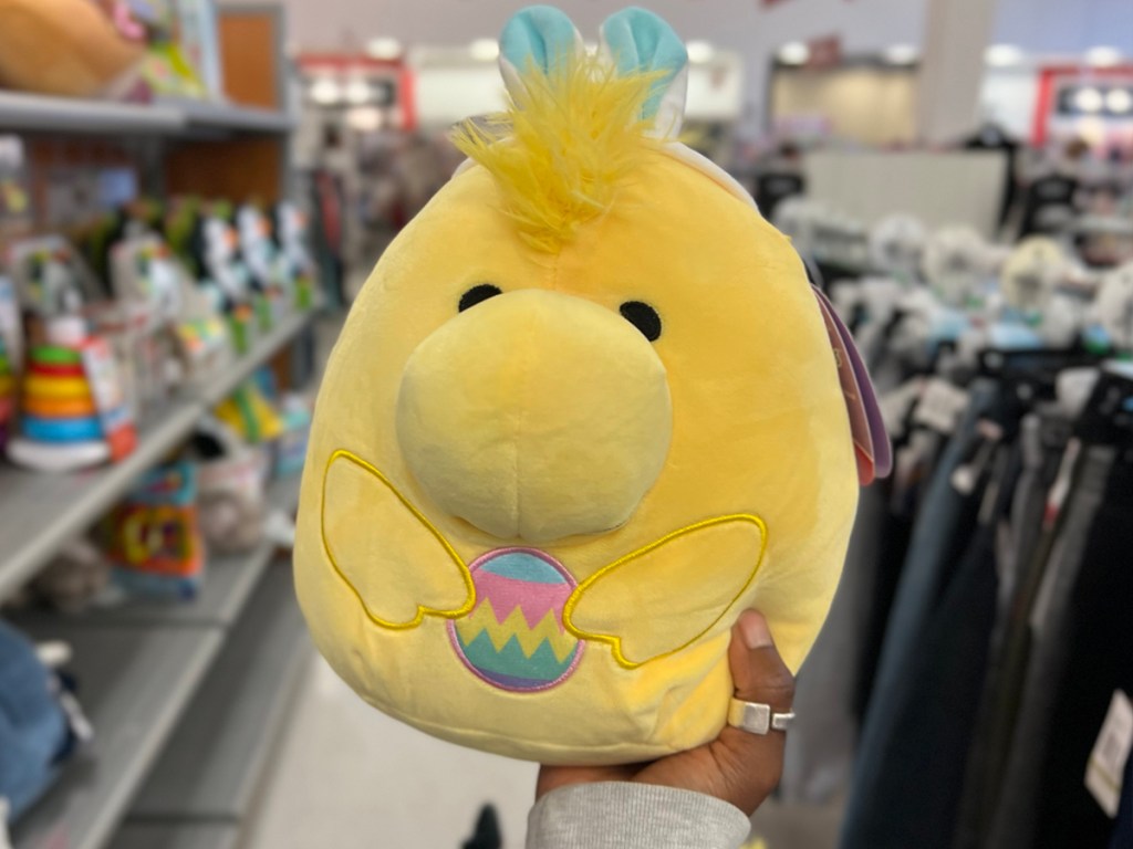 hand holding woodstock peanuts easter squishmallow