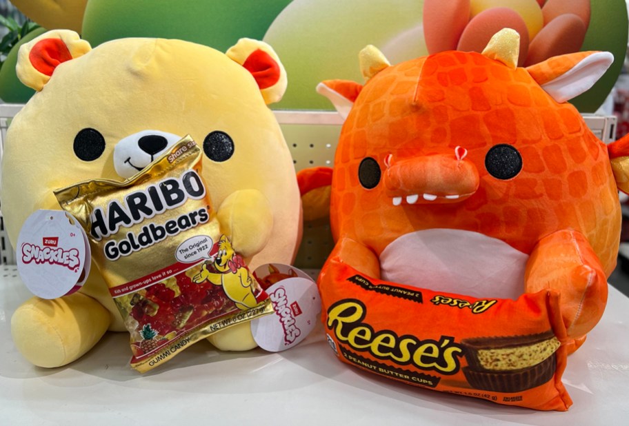 yellow haribo bear and reese orange dragon snackles on shelf