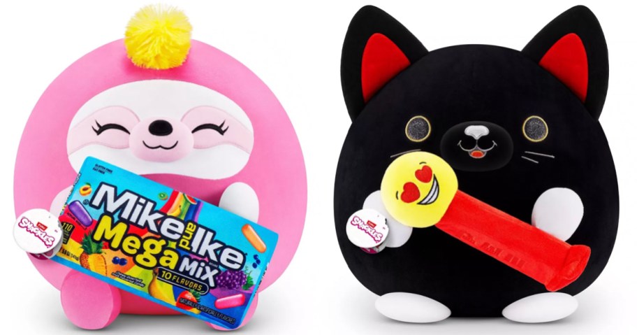 pink mike and ike and black cat with pez plush stock images