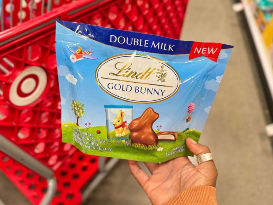 hand holding a Lindt Gold Double Milk Chocolate Bunnies pouch