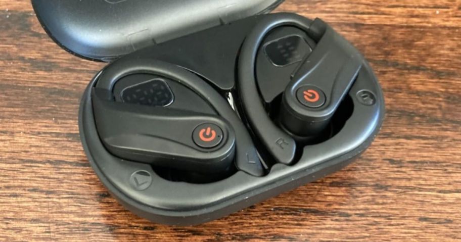pair of black Wireless Bluetooth Over-Ear Headphones in charging case