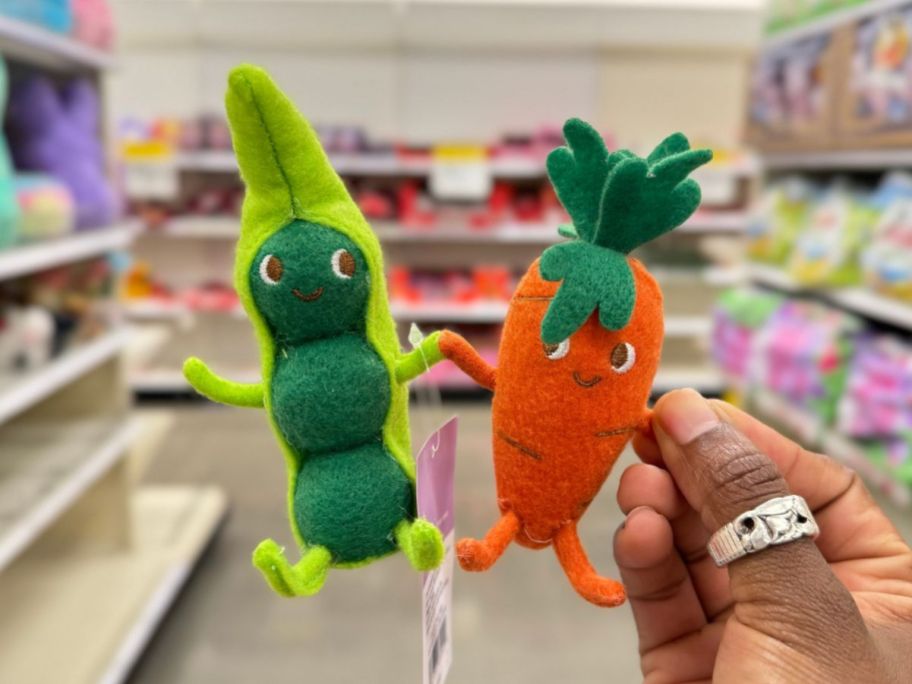 felt pea and carrot duo in person's hand