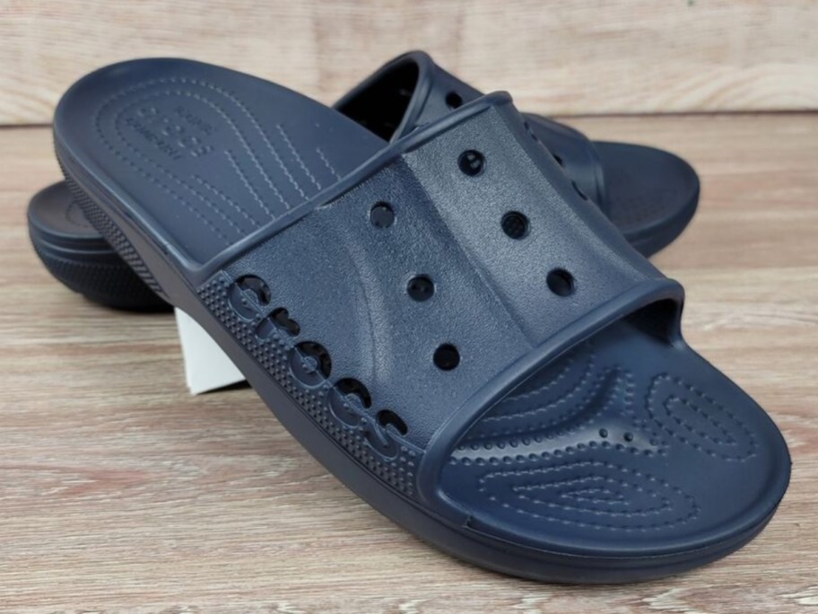 navy blue Crocs slides