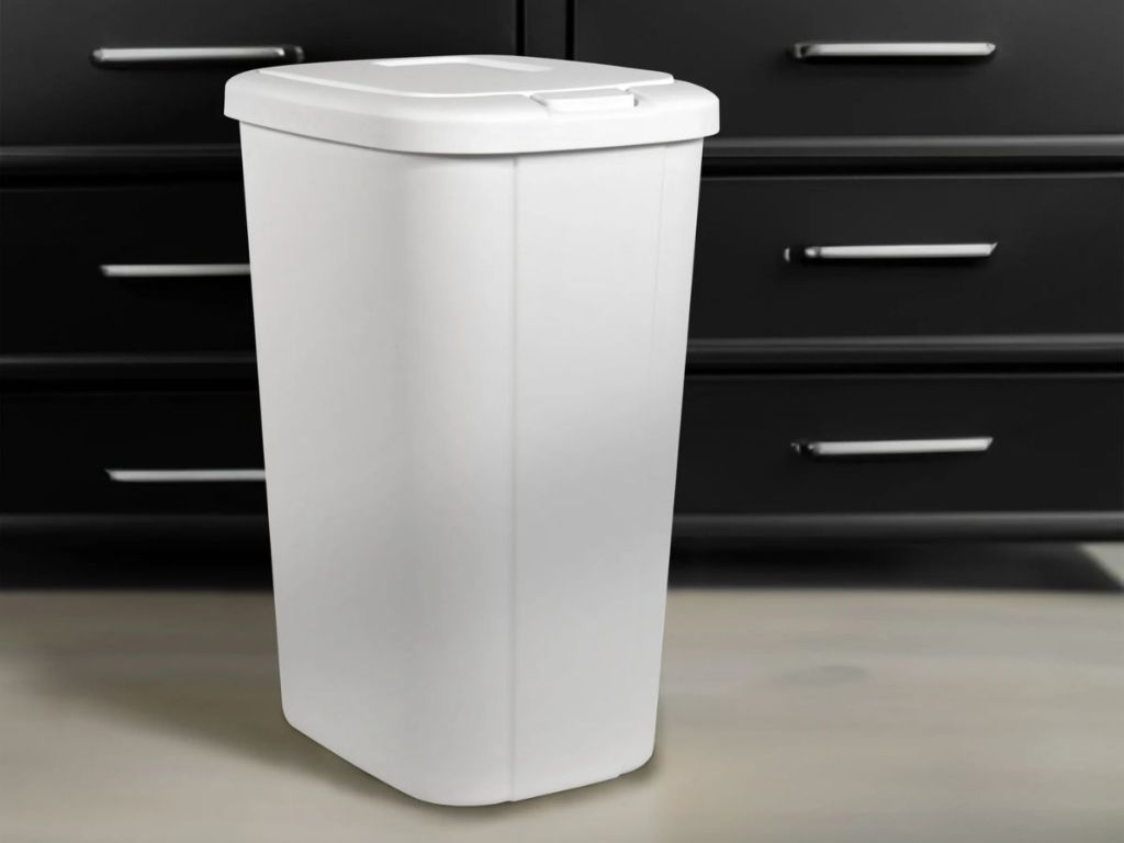 white Hefty plastic kitchen touch top trash can in kitchen with black cabinets