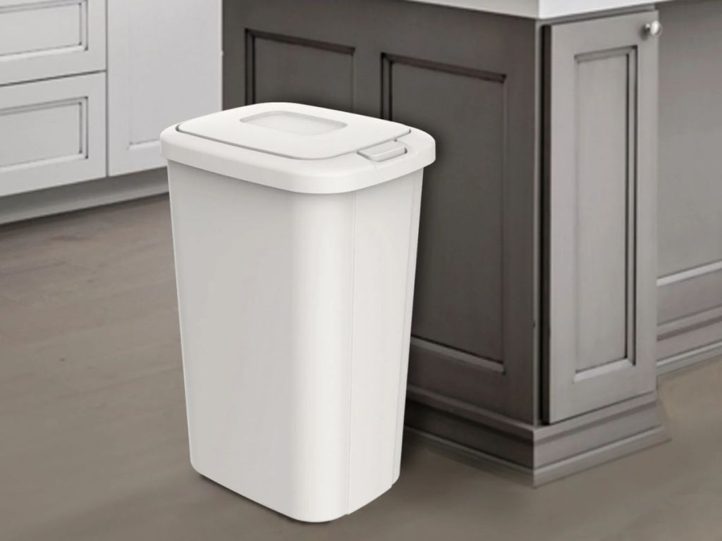 white Hefty plastic kitchen trash can in kitchen with grey cabinets