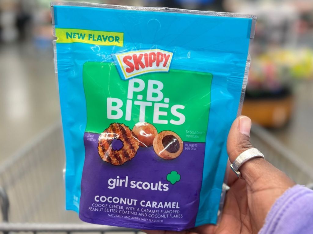 hand holding a bag of SKIPPY PB Bites Girl Scout Coconut Caramel Snack