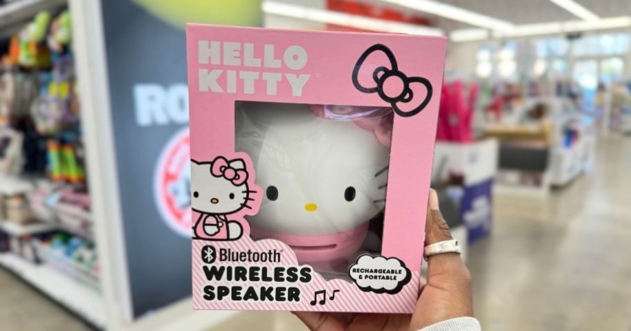 hand holding a box with a pink Hello Kitty Bluetooth Wireless Speaker at Five Below