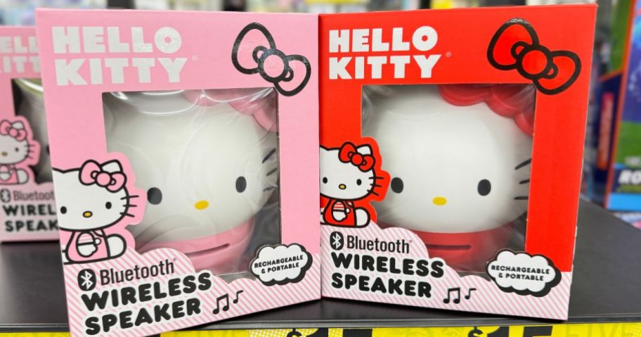 a pink and a red Hello Kitty Bluetooth Wireless Speaker sitting on a shelf at Five Below