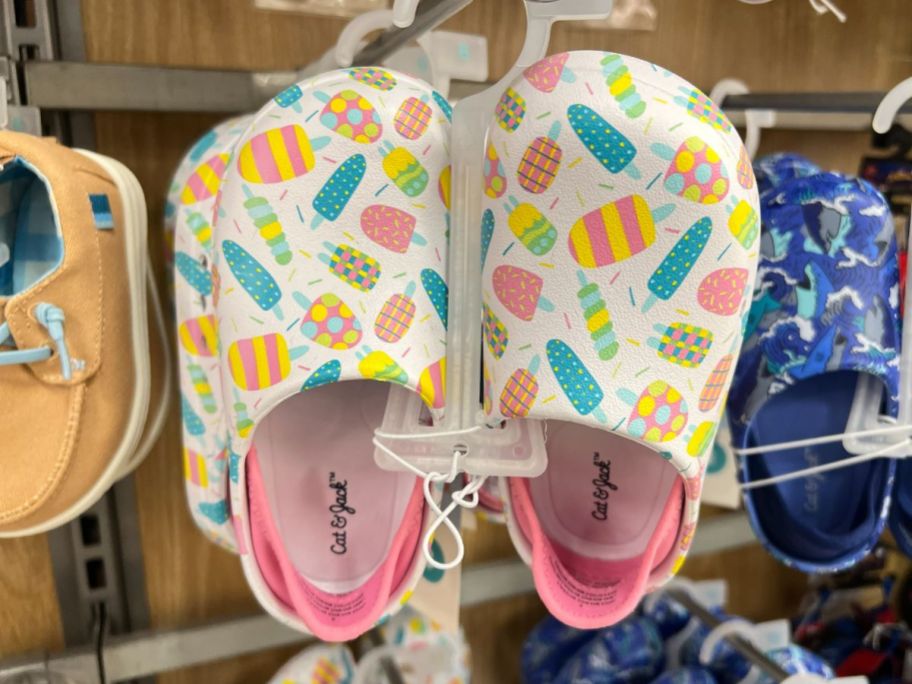 pair of white and pink Cat & Jack Water Shoes with popsicles on them