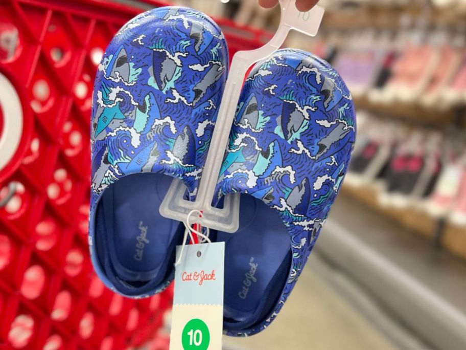 pair of blue kid's Cat & Jack Water Shoes with sharks on them
