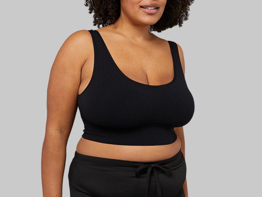 woman wearing black sports bra and leggings 