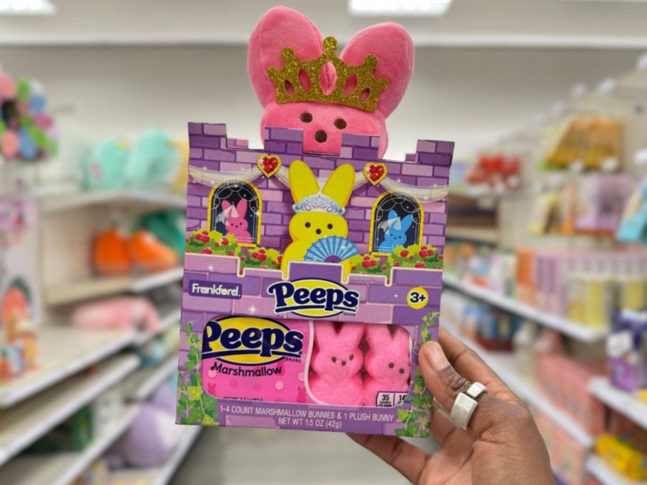 hand holding a Peeps Easter Plush Princess Castle Bunny gift set