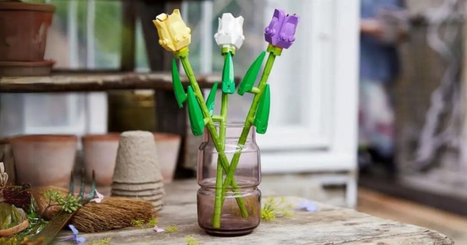 3 LEGO Tulips in a mason jar vase on a table