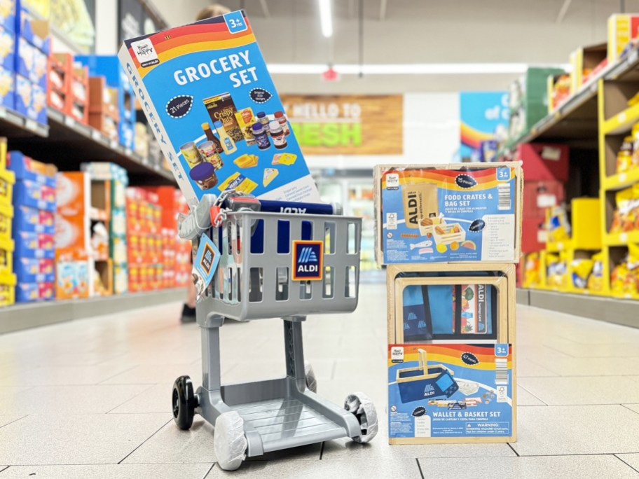 kids aldi shopping cart and grocery shopping toys in aisle of store