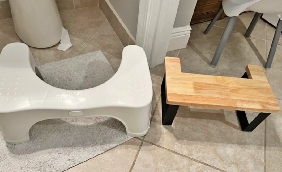 wood toilet stool next to white plastic squatty potty stool