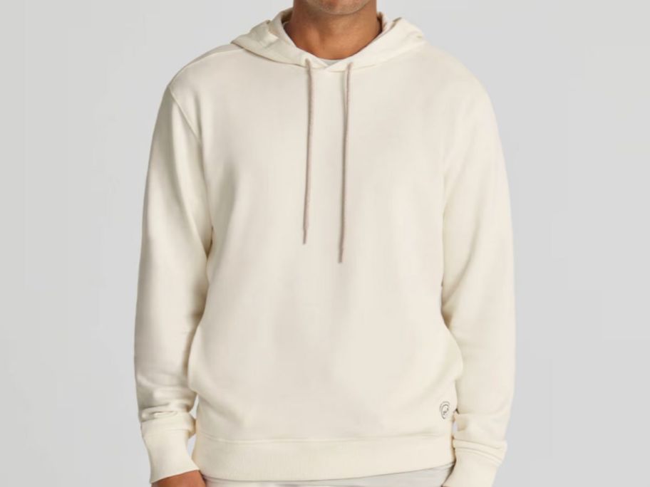 Stock image of a man wearing an Allbirds R&R hoodie