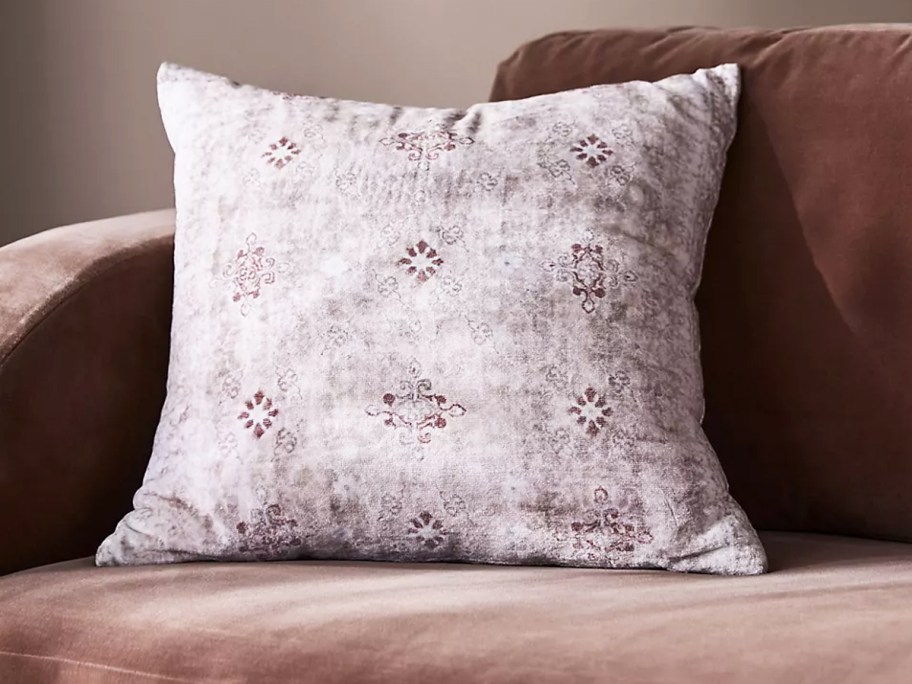 purple throw pillow on a couch