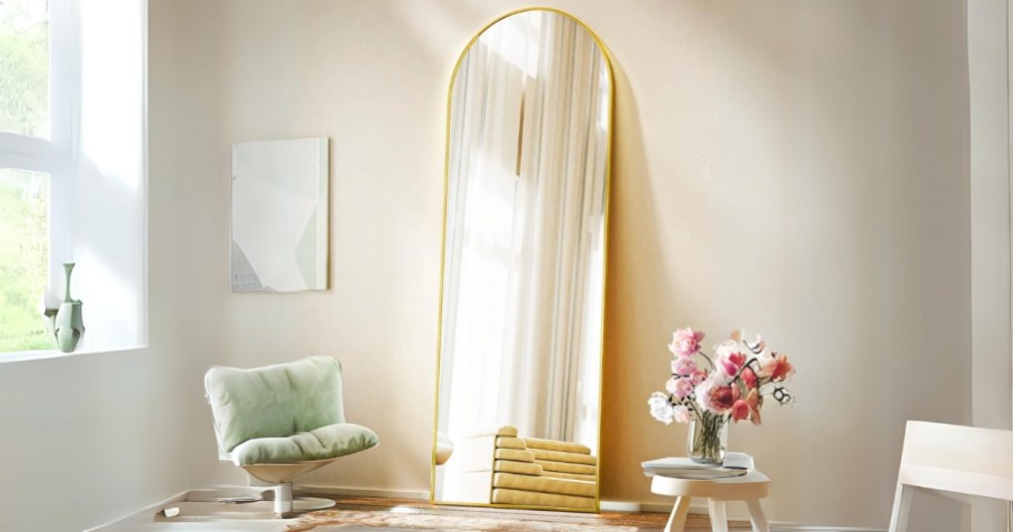 beautypeak arch gold mirror standing against wall in room
