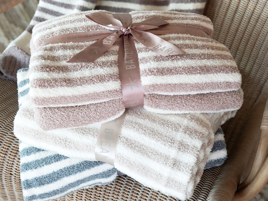 folded stack of striped Barefoot Dreams Throw Blankets