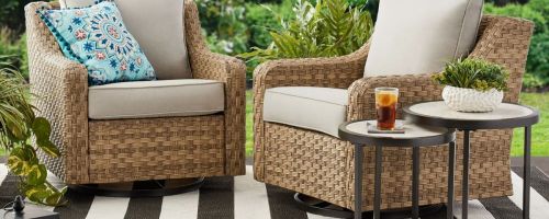 2 wicker glider chairs on a patio