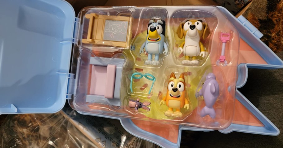 Bluey figures in a shaped case
