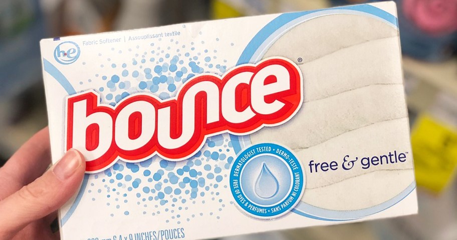 hand holding a white box of bounce dryer sheets